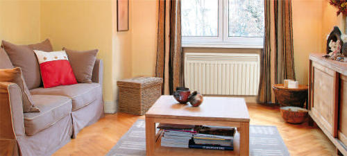 Salon avec un radiateur à inertie Aterno salon radiateur electrique a inertie aterno